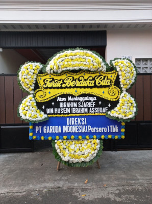 Papan Bunga Duka di Barang